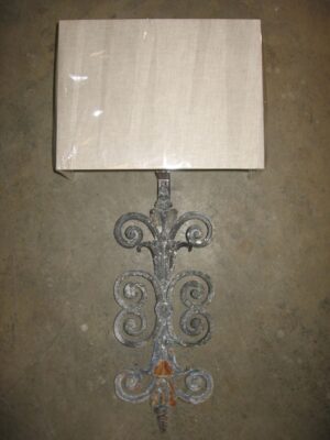 Ferro Designs LLC custom iron wall sconce with a gray, distressed finish. Paired with a half rectangle linen lamp shade.