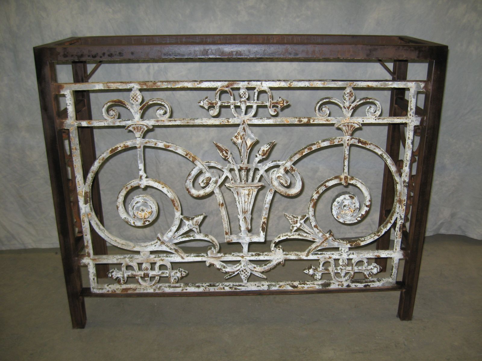 Custom iron console table by Ferro Designs LLC with a dark iron base finish.
