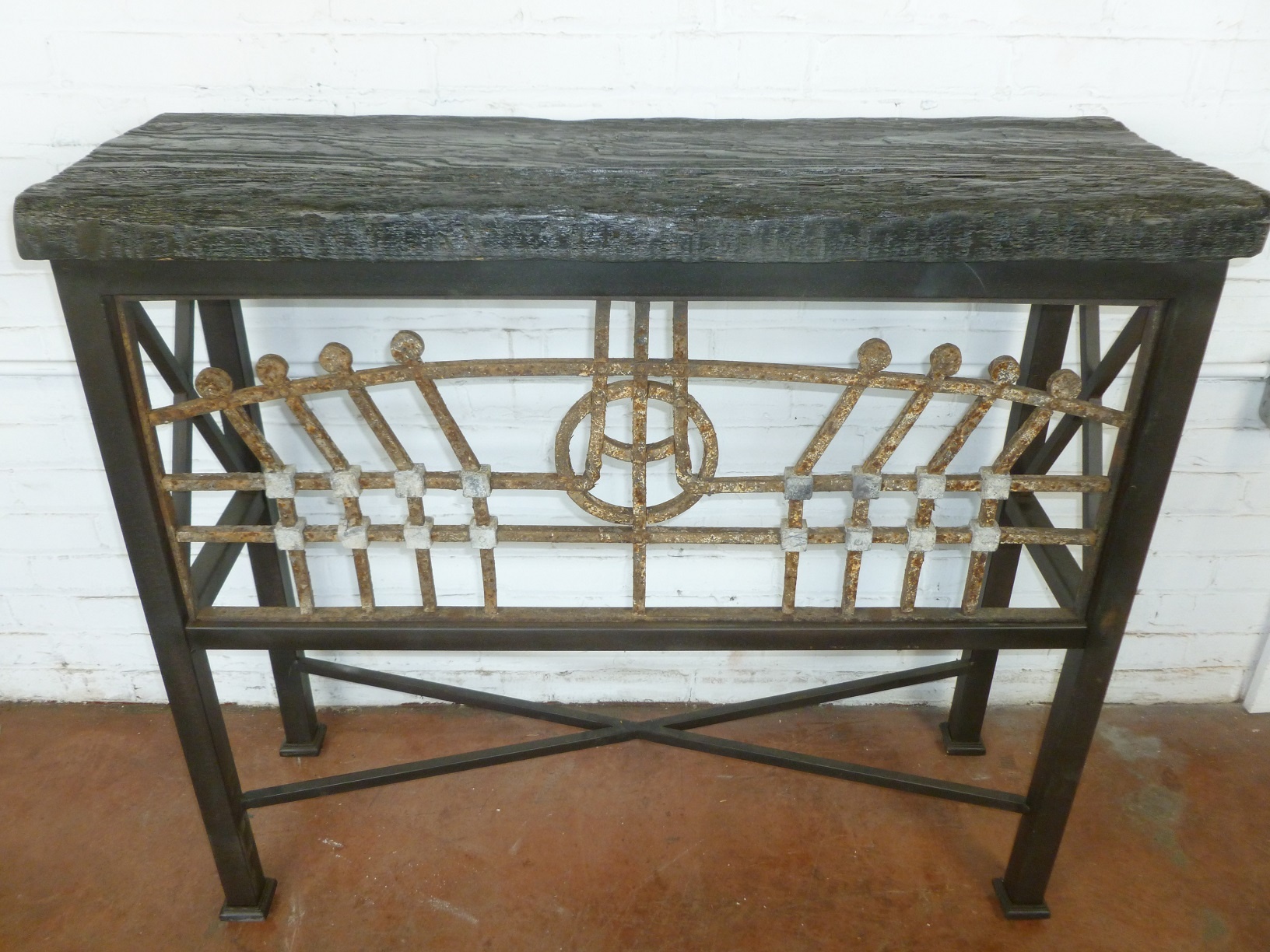 Custom iron console table by Ferro Designs LLC with a dark iron base finish and a barnwood top.