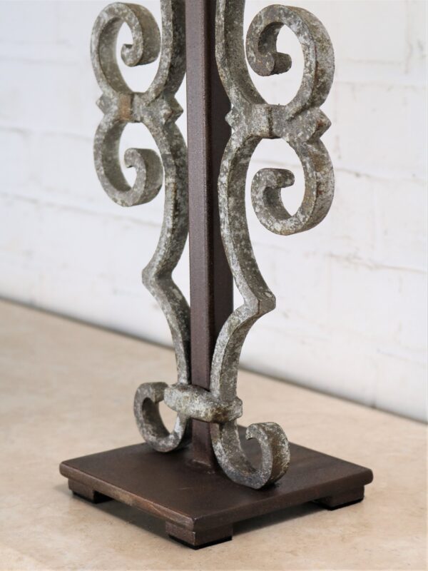 Scroll custom iron table lamp with a white, distressed finish on a dark iron base