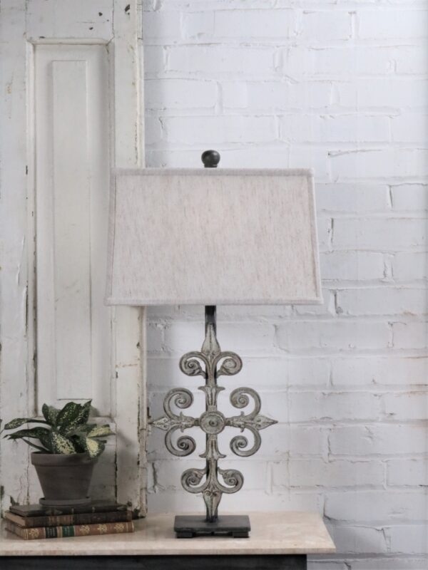 Cross custom iron table lamp with a white, distressed finish on a pewter base