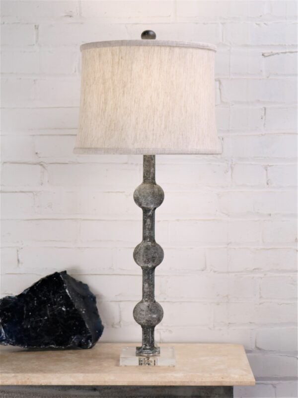 28 inch tall spheres custom iron table lamp with a gray, distressed finish and an acrylic base. Paired with a 12 inch drum linen lamp shade.