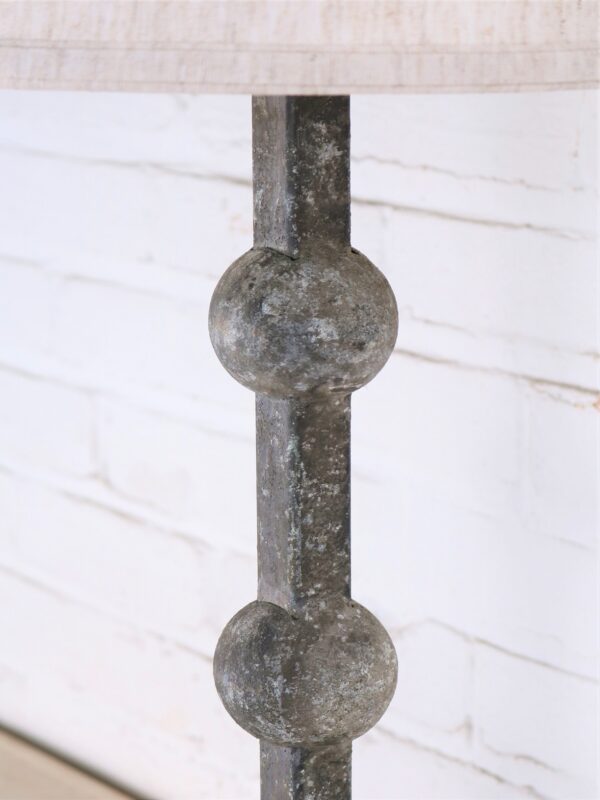 Sphere custom iron table lamp with a gray, distressed finish.