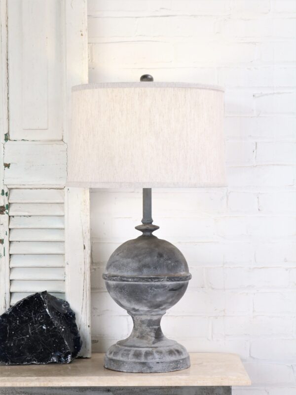 Finial custom iron table lamp with a gray, distressed finish and paired with a 15 inch linen drum lamp shade.