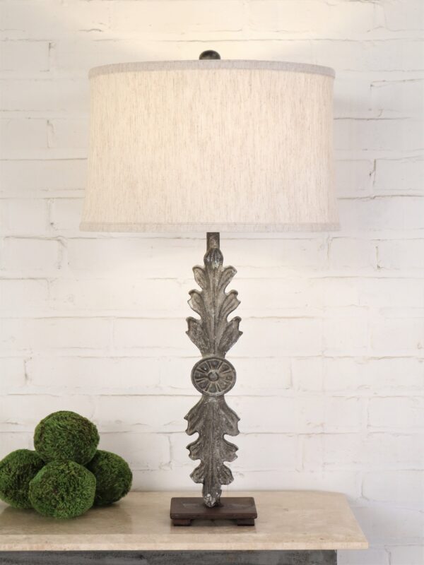 Leaf custom iron table lamp with a gray, distressed finish on a dark iron base. Paired with a 15 inch drum linen lamp shade