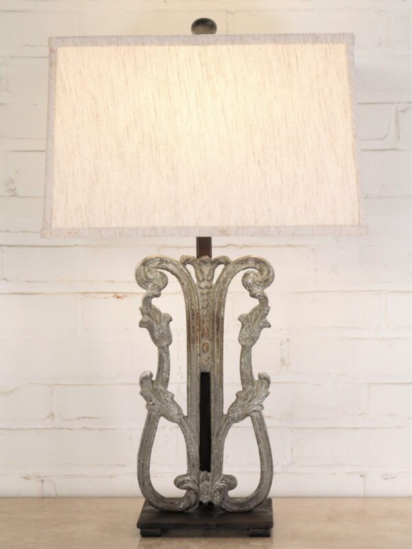 Tulip custom iron table lamp with a gray, distressed finish and a dark iron base. Paired with a 16 inch rectangle linen lamp shade.