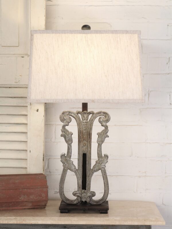 Tulip custom iron table lamp with a gray, distressed finish and a dark iron base. Paired with a 16 inch rectangle linen lamp shade