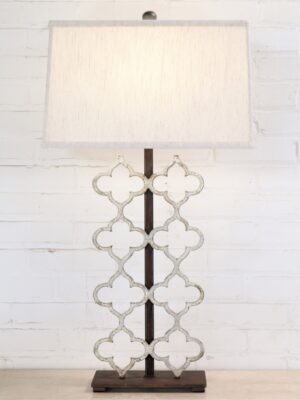 Quatrefoil custom iron table lamp with a white, distressed finish and a dark iron base. Paired with a 17 inch rectangle linen lamp shade.