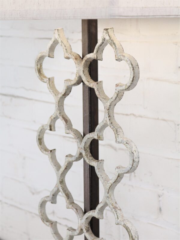 Quatrefoil custom iron table lamp with a white, distressed finish.