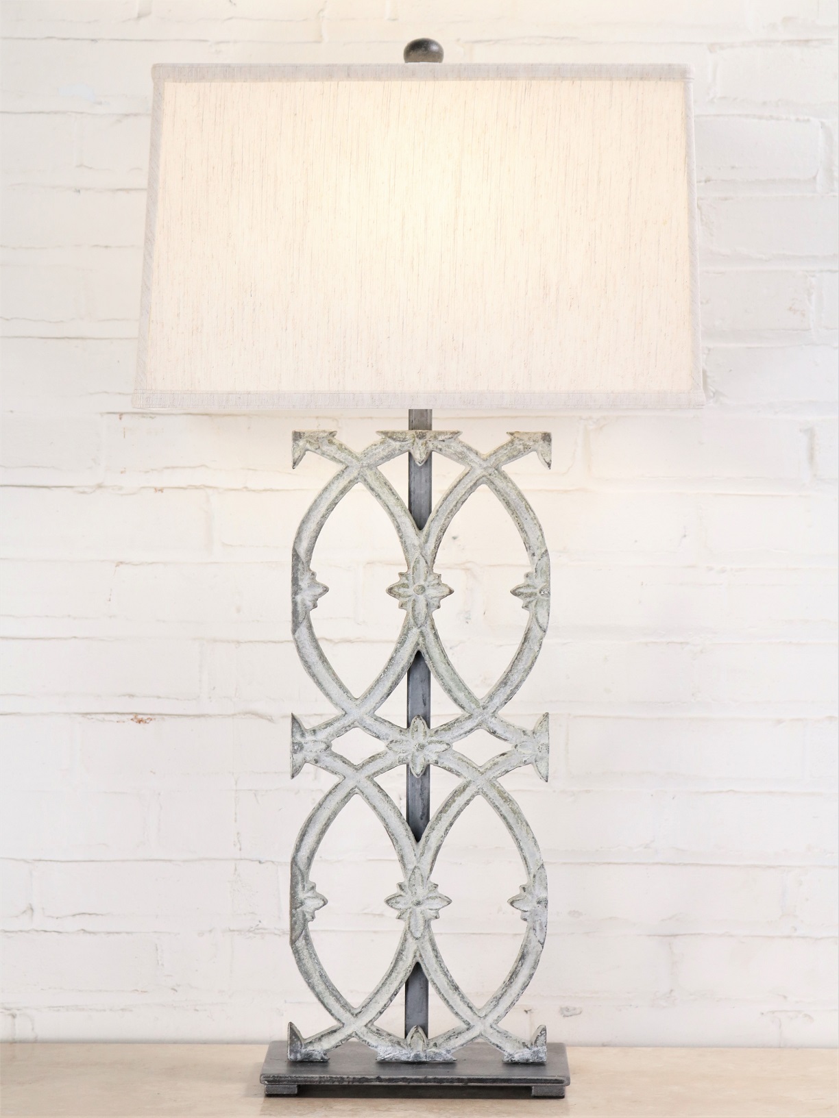 Cathedral custom iron table lamp with a white, distressed finish and a pewter base. Paired with a 17 inch rectangle linen lamp shade.