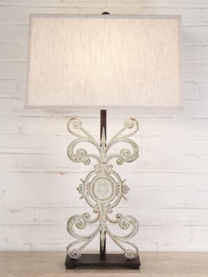 Medallion custom iron table lamp with a white, distressed finish and a dark iron base. Paired with a 19 inch rectangle linen lamp shade.