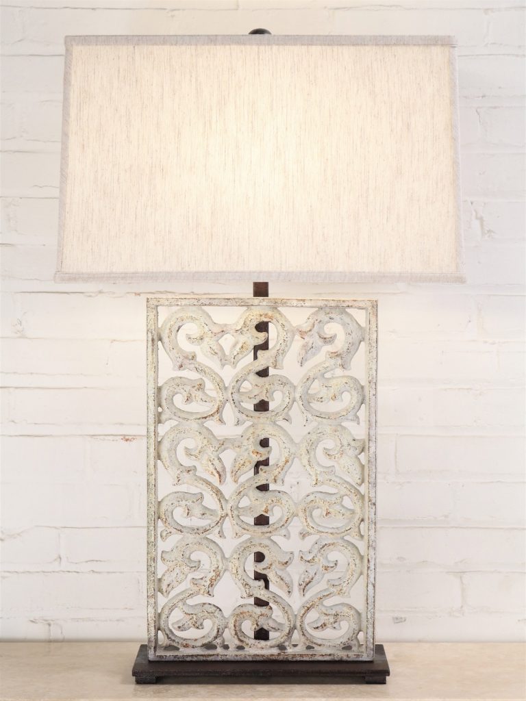 Scrollwork custom iron table lamp with a white distressed finish and a dark iron base. Paired with a 19 inch rectangle linen lamp shade.
