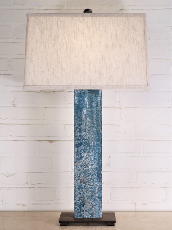 32 inch tall rectangle post custom iron table lamp with a blue, distressed finish and a dark iron base. Paired with a 17 inch rectangle linen lamp shade.