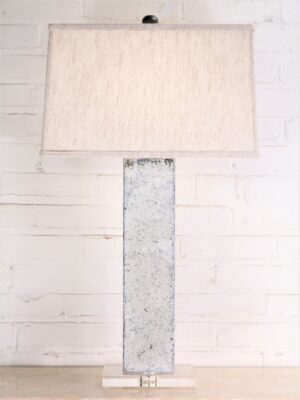 30 inch tall rectangle column custom iron table lamp with a white, distressed finish and an acrylic base. Paired with a 17 inch rectangle linen lamp shade.