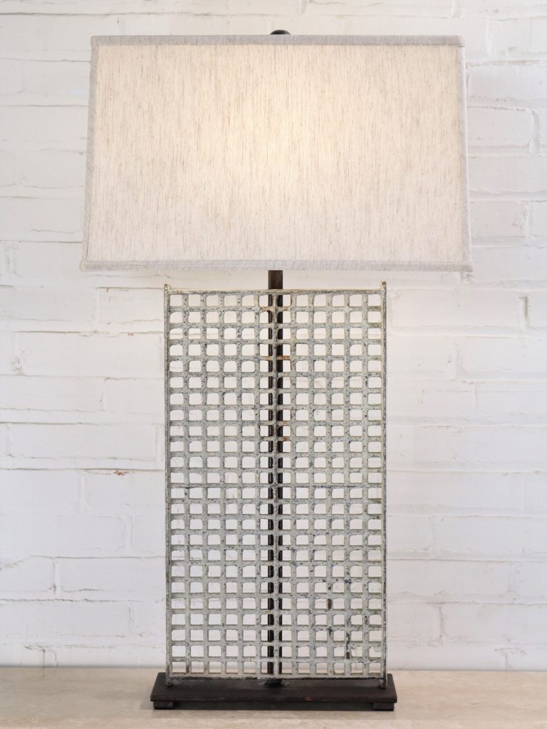 Grid custom iron table lamp with a white distressed finish and a dark iron base. Paired with a 19 inch rectangle linen lamp shade.