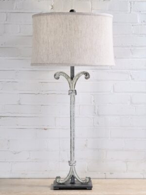 Scroll column custom iron table lamp with a white, distressed finish and a pewter base. Paired with a 17 inch linen drum lamp shade.