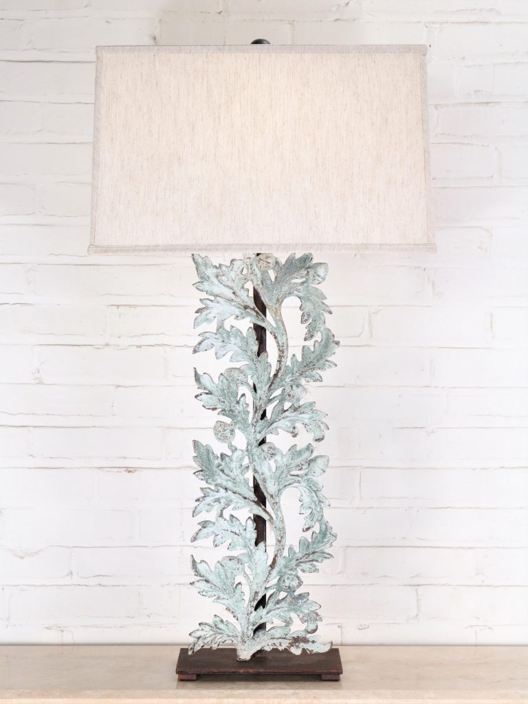 Large oak leaves custom iron table lamp with a patina green, distressed finish and a dark iron base. Paired with a 19 inch rectangle linen lamp shade.