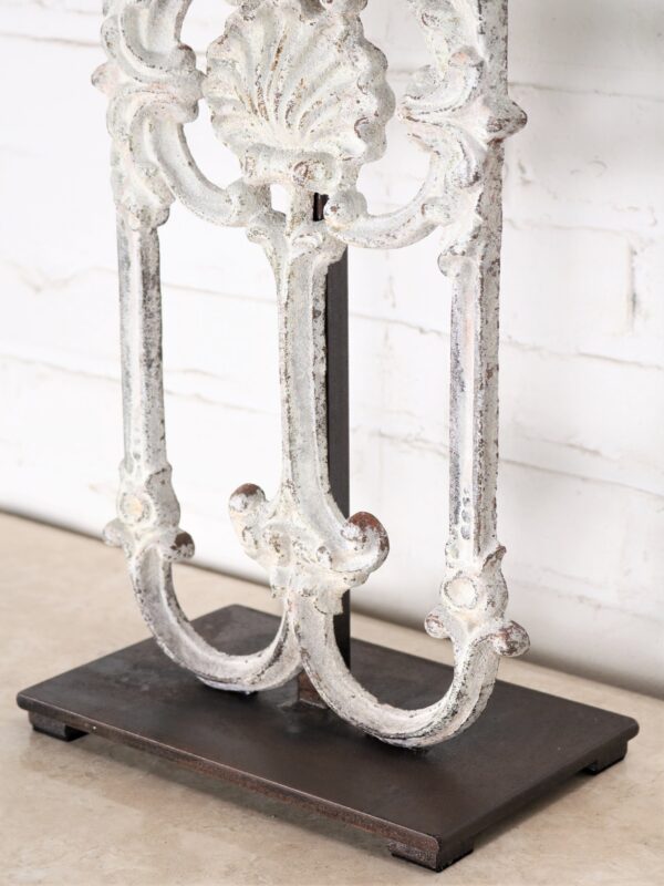 Shell custom iron table lamp with a white, distressed finish and a dark iron base.