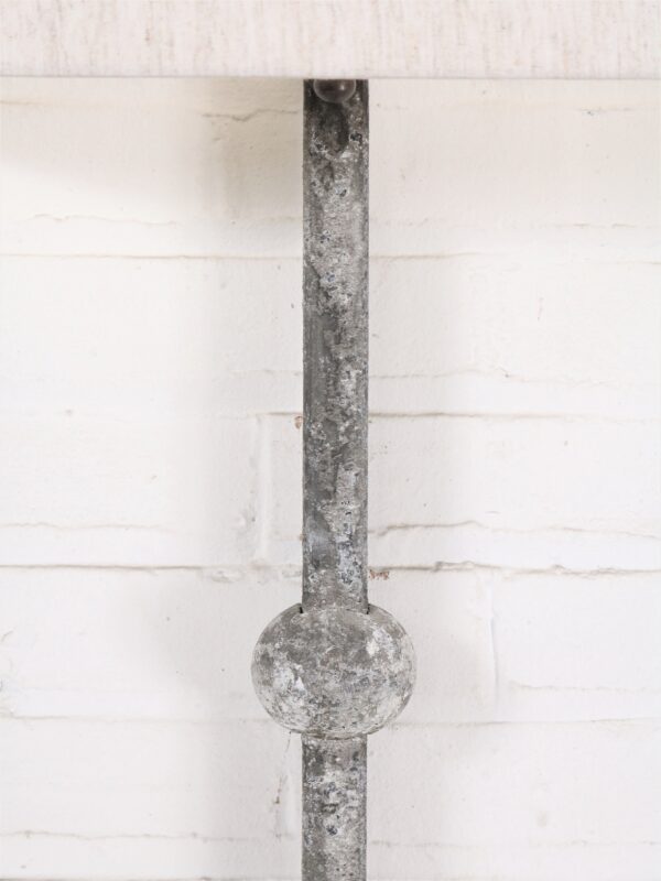 Small sphere custom iron wall sconce with a gray, distressed finish.
