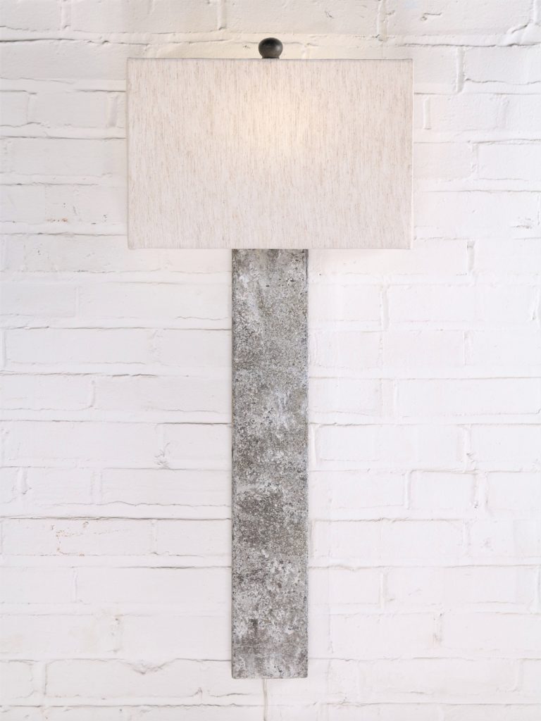 Rectangle post custom iron wall sconce with a gray, distressed finish. Paired with a half rectangle linen lamp shade.