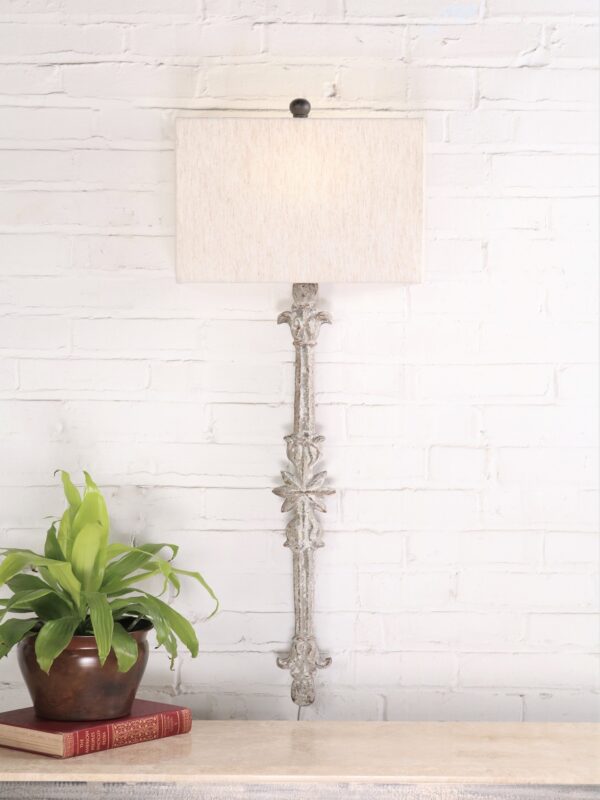 Star custom iron wall sconce with a white, distressed finish. Paired with a half rectangle linen lamp shade.