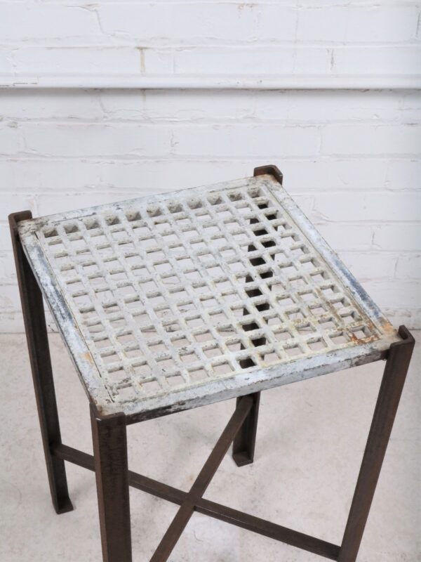 Ferro Designs LLC custom iron drink table or end table with a white, distressed finish and a dark iron base.