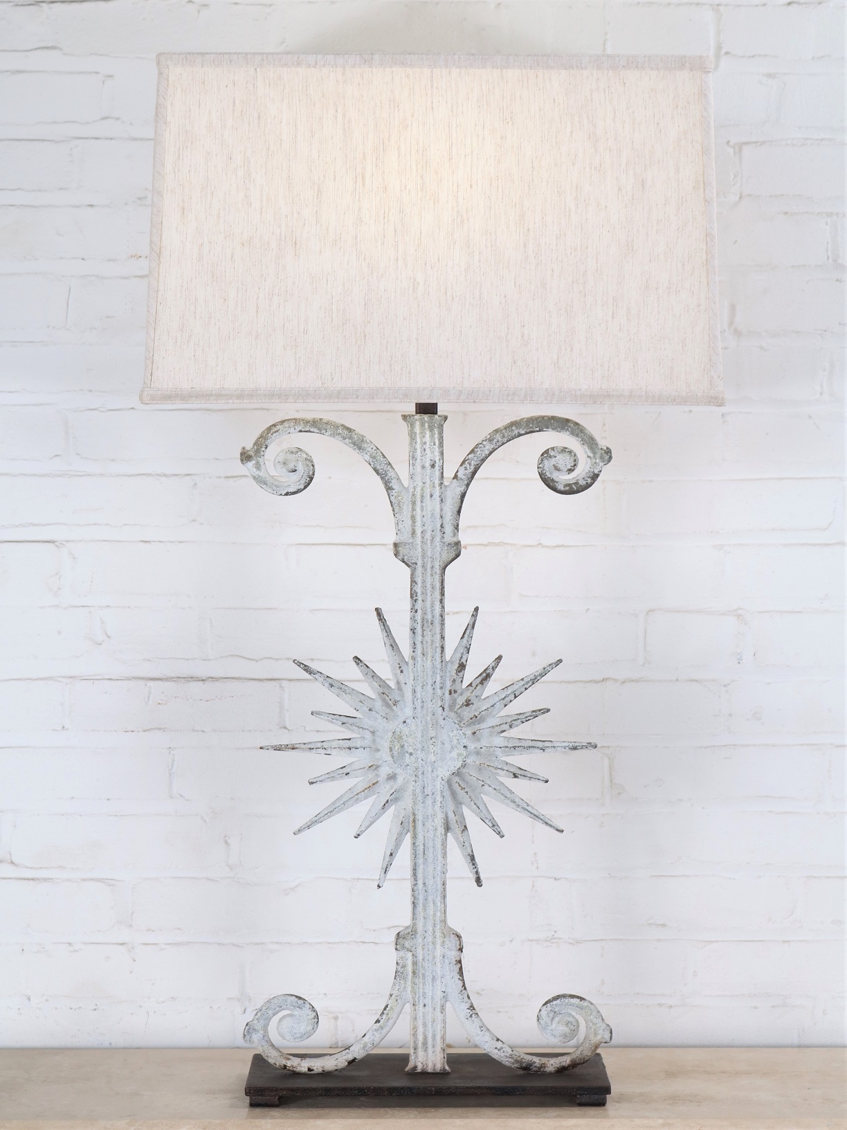 Ferro Designs LLC custom iron table lamp with a white, distressed finish and a dark iron base. Paired with a 19 inch rectangle linen lamp shade.