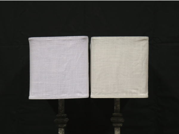 Linen lamp shades on a black background